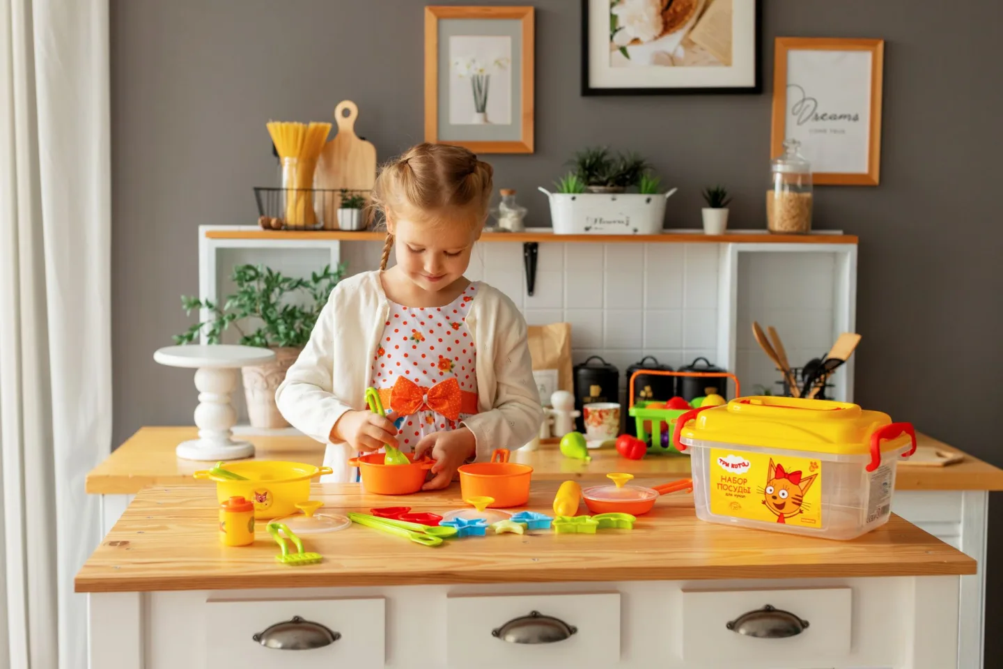 A young child learning to feed themselves at a table