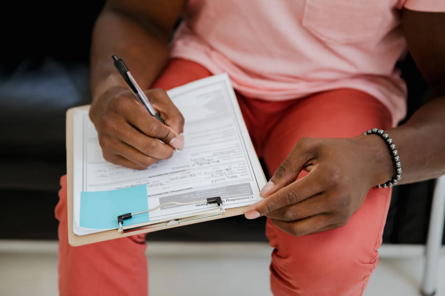 A printed form and a pen on a table