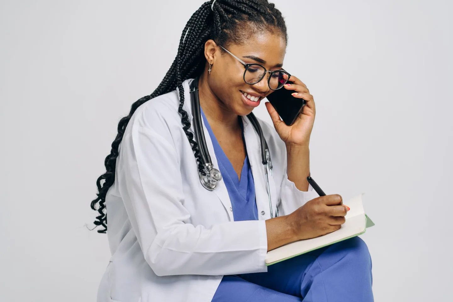A clinician writing at a desk