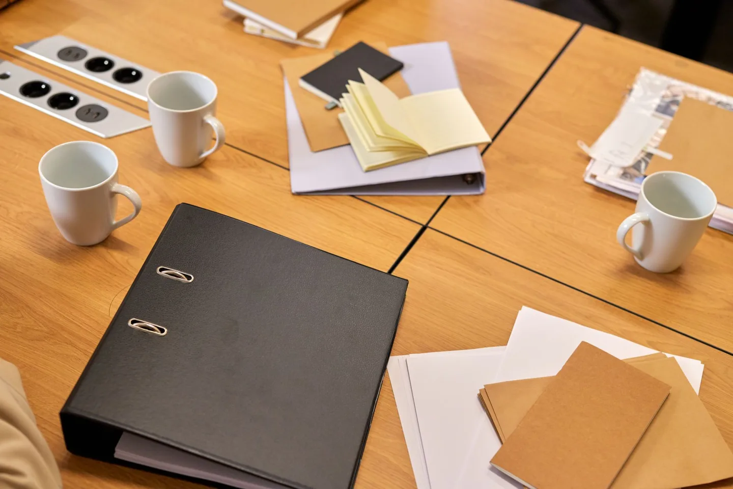 A folder of documents spread on a table