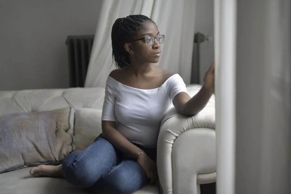A mother pausing in thought at home